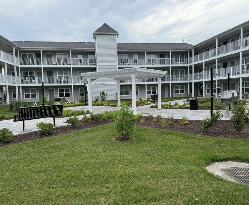a building with a green lawn