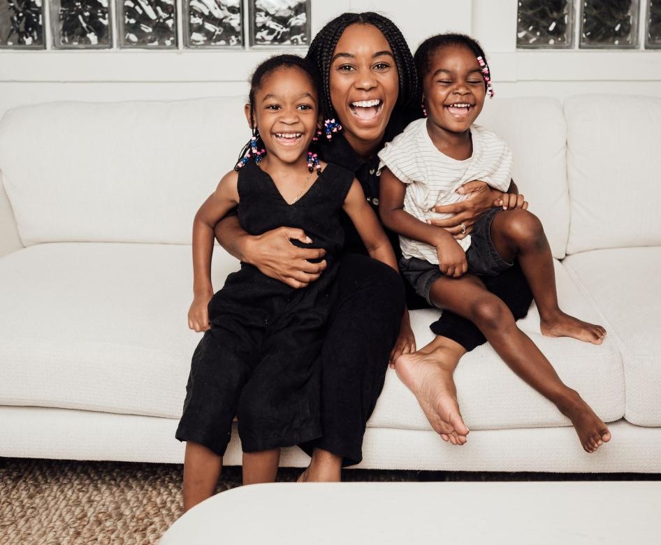 Family sitting on a white couch