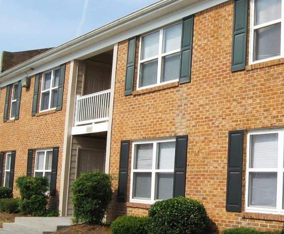 a brick building with a balcony