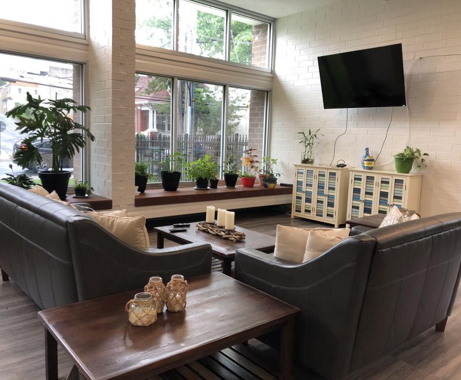 Spacious well lit clubroom with fireplace