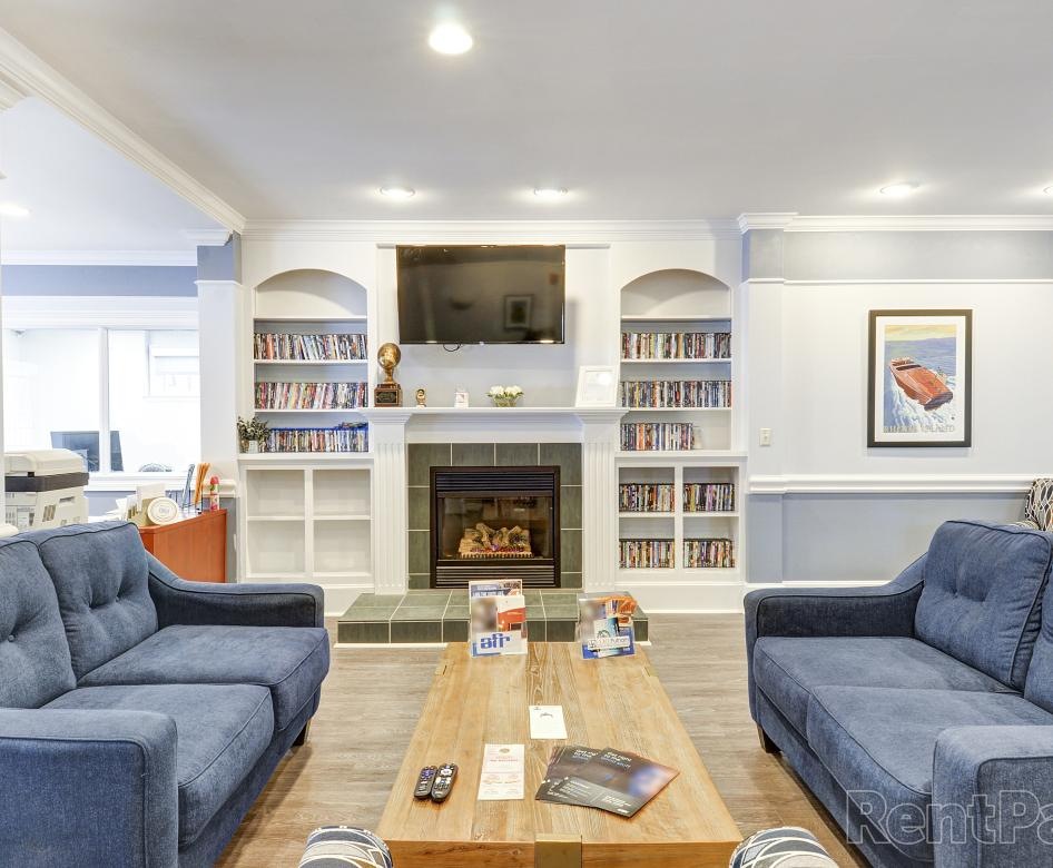 Spacious well lit clubroom with fireplace