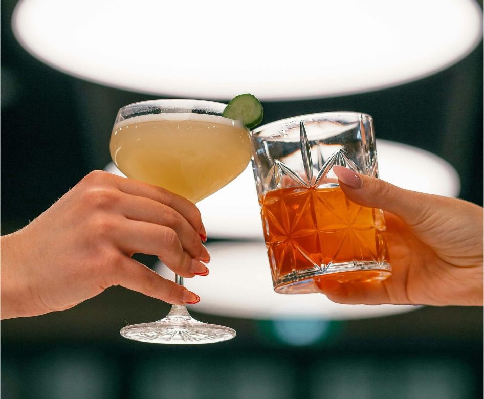 People cheering with drinks 